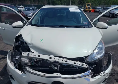 2015 Toyota Prius C One from USA, damaged, VIN JTDKDTB37F1094645